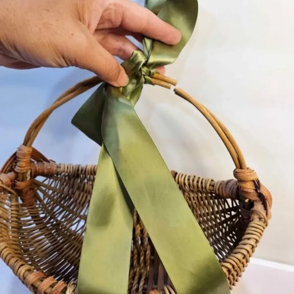 Wicker Basket with Green Ribbon, Broken Handle. Flat side. Wall decor